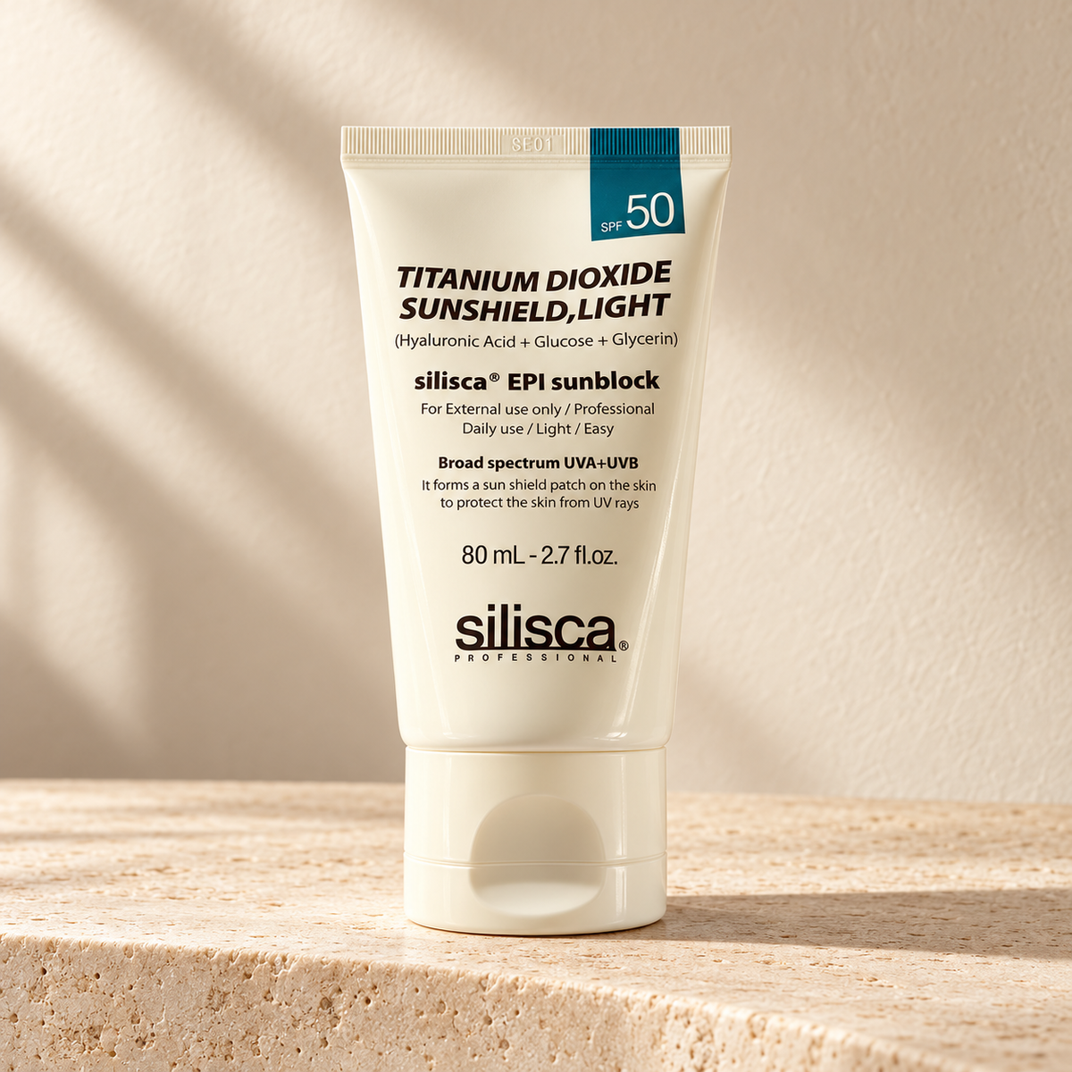 AI-styled presentation of silisca EPI Sunblock Light 80 mL, SPF 50, on a warm cream background
